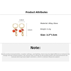 Detail view of crystal beaded peanut pendant earring with dimensions 3.3cm by 1.5cm