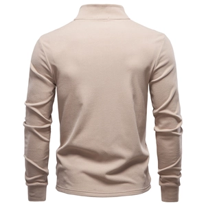 Macro shot of apricot long-sleeved shirt with brushed thermal fabric texture and stitching