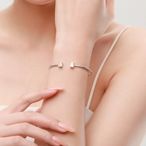 Minimalist S925 sterling silver open bangle with square cubic zirconia on a wrist