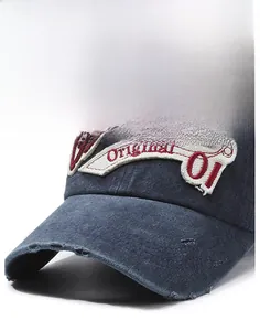 Close-up of vintage washed navy cotton cap with intricate scroll and number embroidery