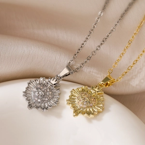 Exquisite gold and silver sunflower necklaces with sparkling zircon inlay on silk background