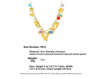 Detailed view of colorful enamel charms and natural stone on an 18k gold-plated necklace