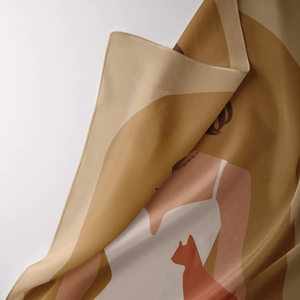 Detailed close-up of bohemian silk tapestry featuring artistic silhouettes and rolled edge
