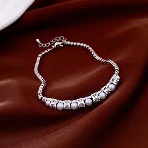 French style pearl and zircon adjustable bracelet with silver chain on red velvet