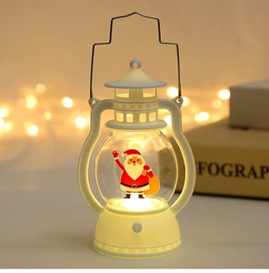 Detail of white mini Christmas LED lantern with Santa Claus pattern and metal handle