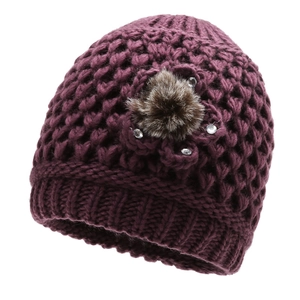 Women's dark purple knitted winter hat with floral accent and warm plush pom-pom decoration