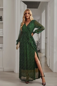 Detailed view of long sleeve V-neck dark green polka dot dress with elegant high side slit