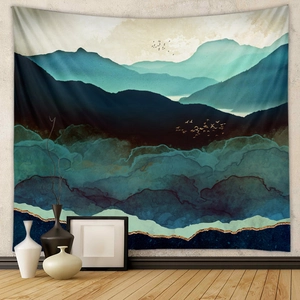 Detail of landscape tapestry with blue mountains and birds hanging on a modern wall