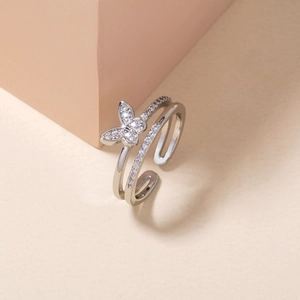 Detail of silver butterfly open ring with double-layer bands and pavé crystals