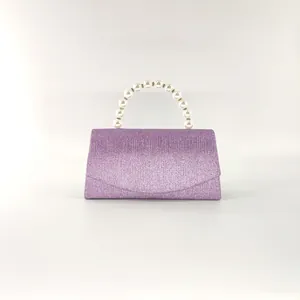 Elegant purple glitter evening clutch bag with pearl handle and sparkly sequin finish