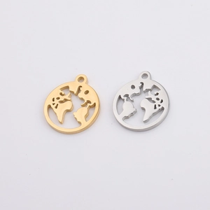 Flat lay of gold and silver hollow world map earth pendants on a white background