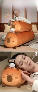 Capybara plush bolster and doll showing size comparison and soft texture for home use