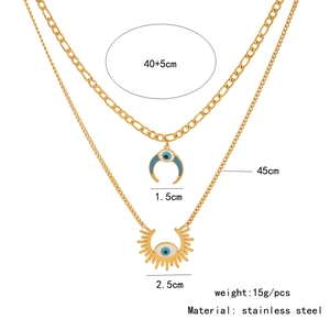 Detail of double-layer stainless steel necklace with blue evil eye charms and dimensions