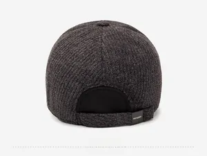 Detailed back view of a men's winter baseball cap with charcoal tweed texture and brand label