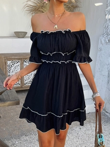 Detail of off-shoulder black dress with white ruffle trim and short sleeves in summer style