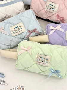 Quilted pastel pencil cases with bow detail and HAPPY patch for school and makeup