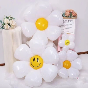 Detailed view of daisy foil balloons in various sizes with smiley face for party decor