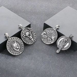 Detailed relief of Viking wolf, deer, and Yggdrasil patterns on round steel pendants