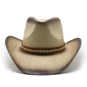 Detailed view of hand-painted edges and woven band on a wide-brim straw cowboy hat