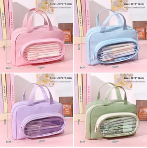 Detail showing four pastel Oxford cloth pencil cases with transparent windows and 20x6x13cm size