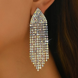 Detailed close-up of long silver cascading tassel earrings with sparkling rhinestones