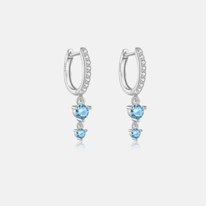 Macro view of S925 sterling silver hoop earrings with sky blue zircon and small crystals