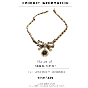 Detailed product info for leather wrap necklace with metal bow and circular pendant