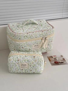 Floral corduroy makeup bag set in green daisy print with ribbon zipper detail