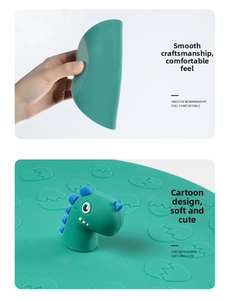 Detailed view of flexible green silicone drain cover with 3D cartoon dinosaur handle