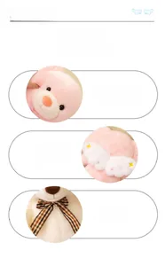 Close-up of pink teddy bear plush with white angel wings and plaid bow tie details