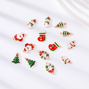 Macro shot of 14 mixed Christmas enamel alloy charms including Santa, snowmen and trees