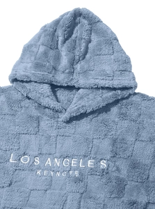 Close-up of Los Angeles embroidery on soft blue sherpa fleece hooded sweatshirt