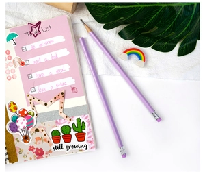 Flat lay of purple DIY diary set with pencils, sticker notebook, and to-do list detail