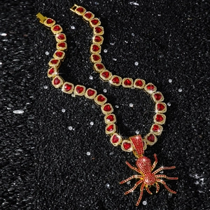 Hip-Hop gold spider pendant necklace featuring red heart crystals on a cuban chain