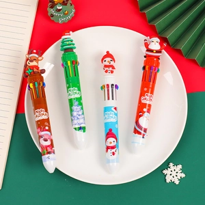 Christmas 10-color shuttle pen with 3D Santa and reindeer toppers on a festive desk