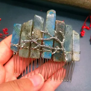 Detail of handcrafted blue labradorite crystals and silver metal branch hair comb