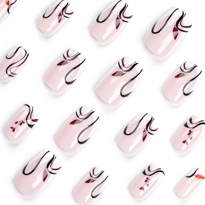 French style square fake nails with black curves and red leaf patterns on pink base