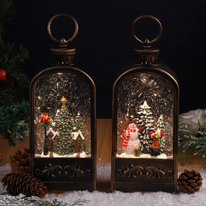 Vintage bronze Christmas lanterns with festive LED scenes of snowmen and Santa Claus