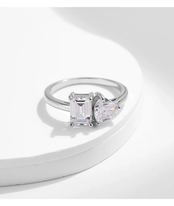Detailed macro view of S925 silver ring featuring emerald cut and heart shaped crystals