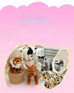 Detailed close-up of plush animal toys featuring a tiger, deer, leopard, and cow collection