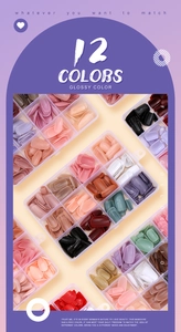 Glossy artificial nails set in a 12-color transparent storage box with diverse vibrant shades