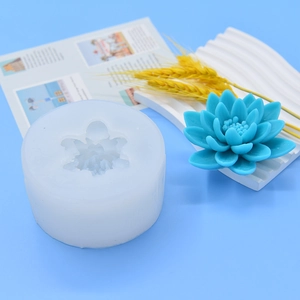 Lotus flower silicone fondant mold with detailed blue petal craft on blue background