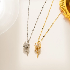 Detailed close-up of spinning sunflower necklaces in gold and silver with cubic zirconia