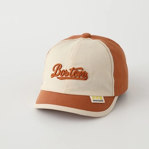 Close-up of Boston embroidery and side label on kids' color-block baseball cap