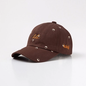 Detailed embroidery of hola and kukuji letters on brown kids baseball cap