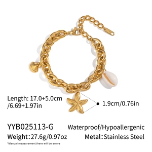 Detail of 18K gold plated stainless steel ocean bracelet with shell and starfish charms