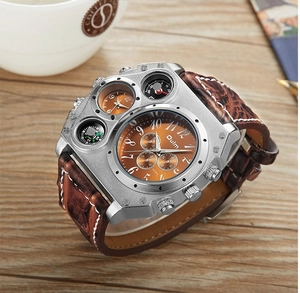 Close-up of Oulm multi-dial sports watch with brown leather strap on a wooden table