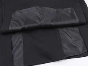 Detailed close-up showing the precise stitching and black satin lining of this blazer jacket