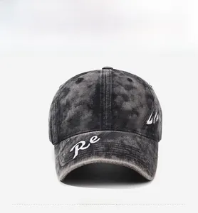 Detail of vintage washed gray baseball cap featuring white 3D letter embroidery