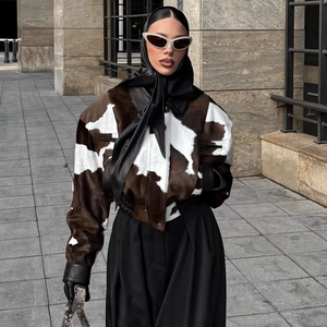 Women's street style cow print short jacket with brown and white faux fur and leather trim